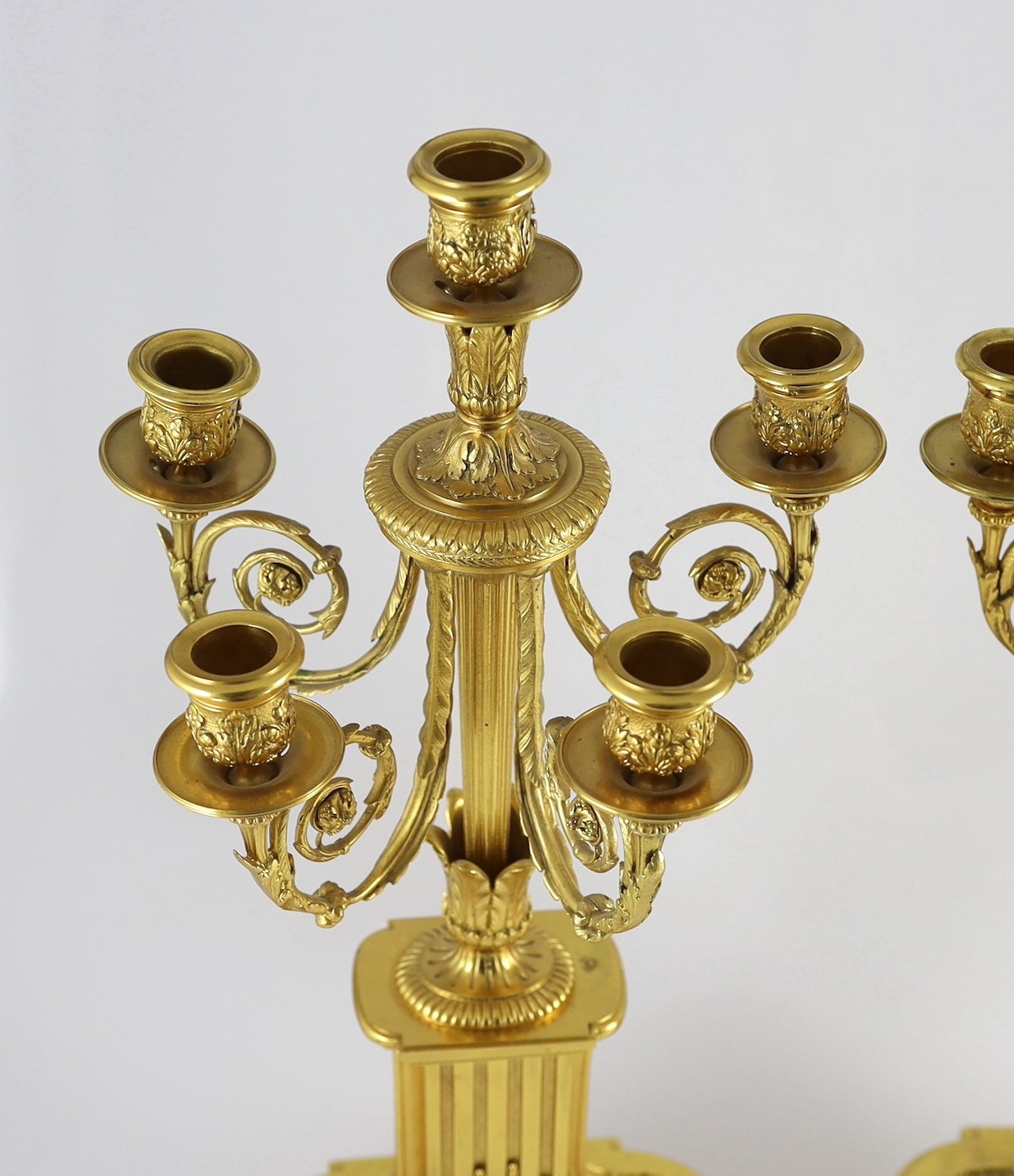 A pair of 19th century French ormolu five light candelabra, 26cm wide, 56cm high